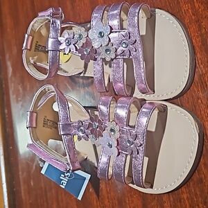 Pink   lil girl toddler sandals size 11.. with flower  appliques. Very cute.